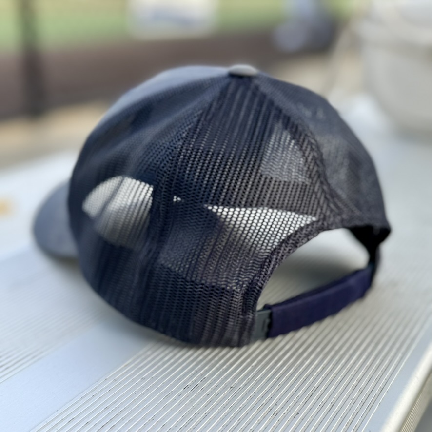 SNPSLV sleeve on the back strap of a cap
